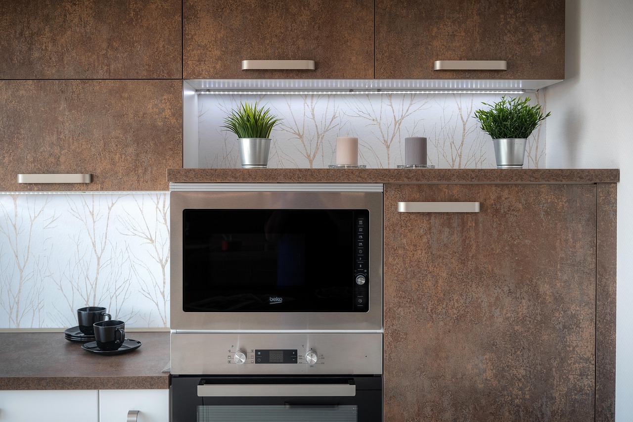 Custom-built kitchen cabinets with integrated oven and microwave