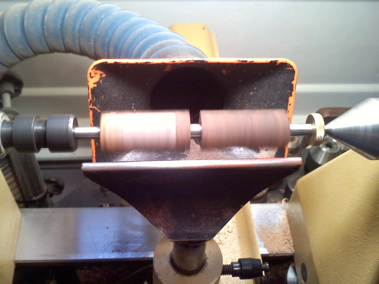 Close-up of a wood lathe shaping a wooden spindle in the SMC workshop